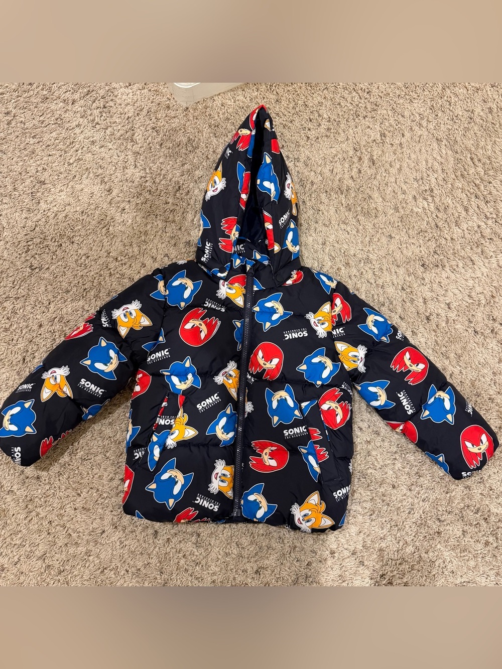 H&M Black Sonic Graphic Puffer Jacket with Red & Blue Accents